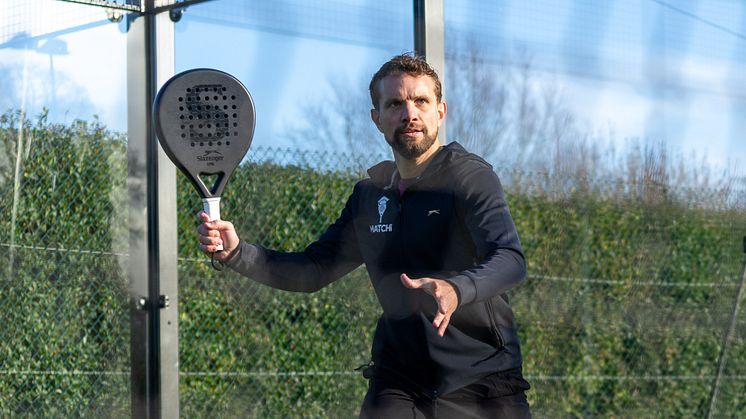 Sandy on a sunny january day in England playing the all black Epic racket wearing our Robin Hoodie !