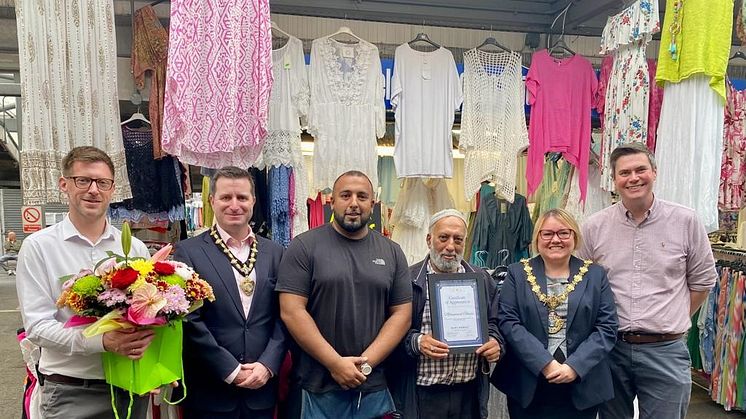 Mohammed Ghyas is presented with gifts by the Mayor of Bury on his 50th anniversary of trading on Bury Market. Also pictured is his son Waqas, the mayor’s consort James Bentley, and market managers Simon Green and David Catterall.