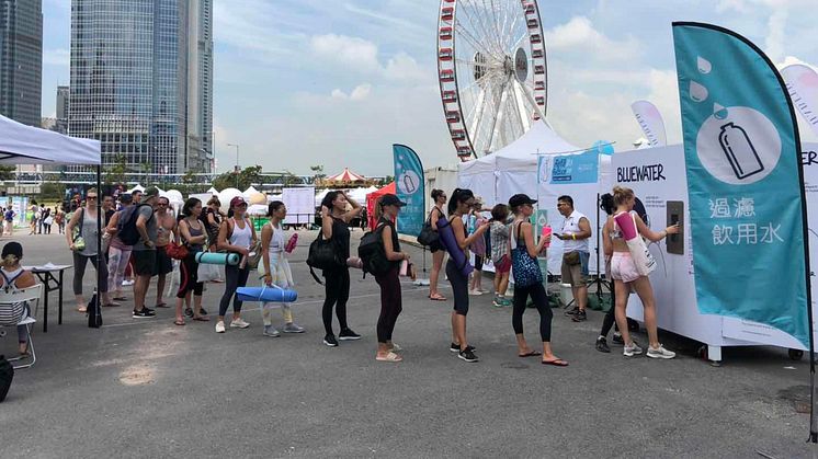 Yoga fans line up for water as pure as nature intended from Bluewater hydration station at Hong Kong's open-air IRIS yoga and meditation festival