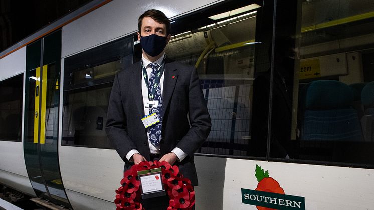 Chris Fowler, Customer Services Director for Southern, welcomes the poppy train into platform 8 (driven by forces veteran, Marc Stoner)