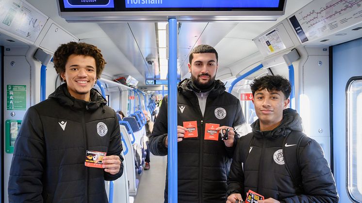 Up for the cuppa: Stevenage Academy players [l to r] Kymani Skyers, Tanil Salik and Baron Cambaz gave passengers teabags and smiles on the Thameslink Brew Train [more downloadable images below]