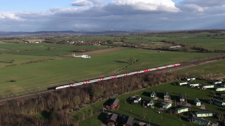 VIRGIN TRAINS EAST COAST TRAIN ESCORTED BY ROYAL NAVY LYNX HELICOPTERS