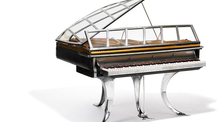 Poul Henningsen: "PH Grand Piano". Black stained wood, chrome steel and edge covered with black leather. Sold for: DKK 2,450,000 (EUR 430,000 including buyer’s premium).