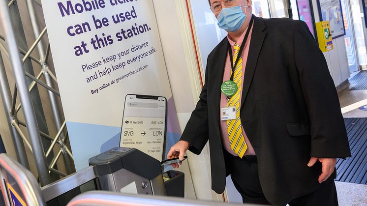 Cllr Paul Clark, Hitchin ward member and executive member for planning and transport at North Herts District Council, uses an e-ticket at Hitchin station