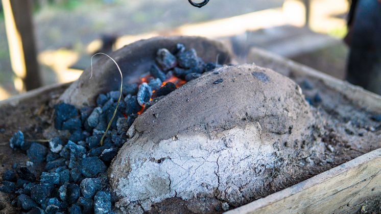 A blacksmith furnace using medieval techniques to create metal objects