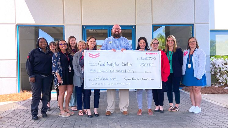 Doug Belisle of the Good Neighbor Homeless Shelter receives a donation from Yanmar America’s Community and Events Committee at a ceremony at Yanmar’s Adairsville Headquarters.