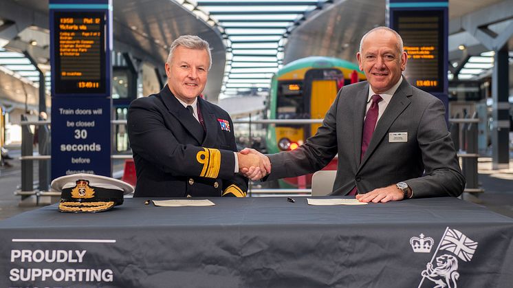 Rear Admiral Phil Hally CB MBE, Assistant Chief of the Defence Staff, and Patrick Verwer, CEO of Govia Thameslink Railway, sign the agreement. More images below.