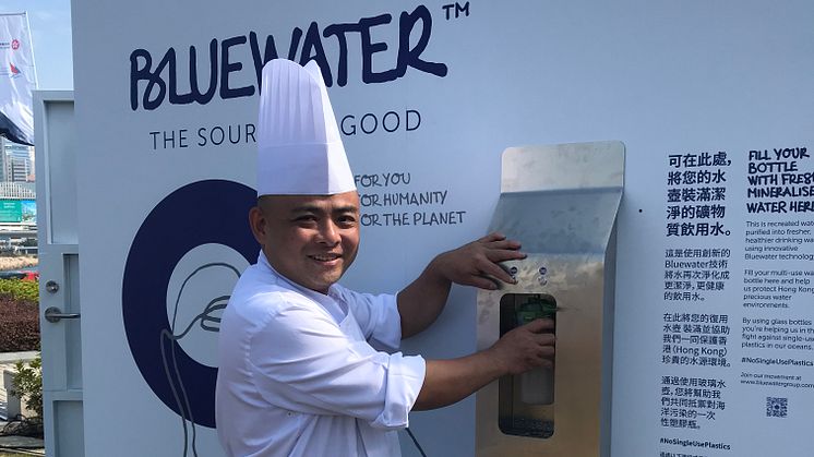 The pure water delivered from a Bluewater hydration station in the Volvo Ocean Race Village in Hong Kong puts a smile on the face of a Chinese chef .