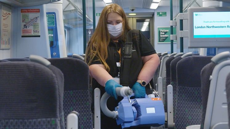 A fogging machine in use on a London Northwestern Railway train