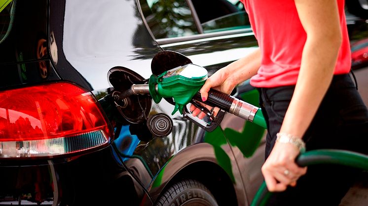 Motorist filling up at the pumps