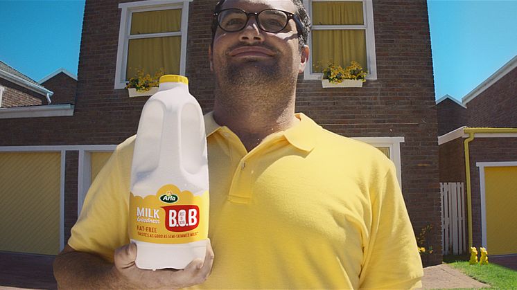 Arla brings bold bursts of yellow to a town called compromise in new TV ad for Arla "Best of Both" milk
