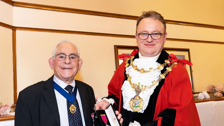 Picture: Henry Donn is presented with his Freeman of the Borough medal by the Mayor of Bury, Cllr Tim Pickstone.