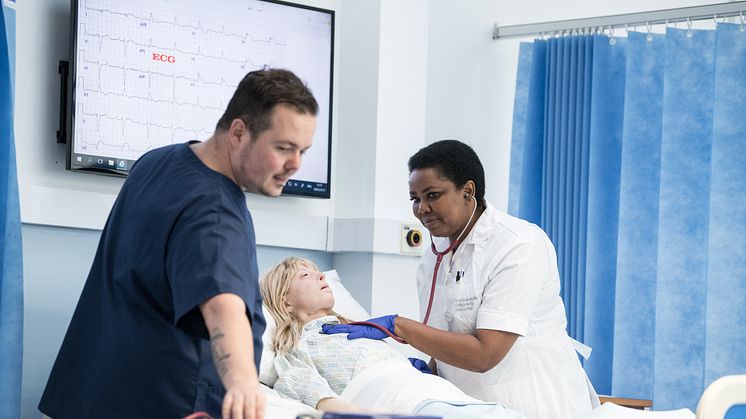 Lecturer Barry Hill with nursing student Florence Pobee