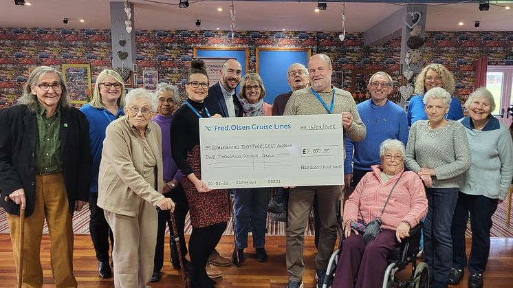 Ellis Orchard, from Fred. Olsen Cruise Lines, and Henry Tapp, from Suffolk Community Foundation, with Tracey Evans and Colin Baldwin and those enjoying the Ipswich Chinwag group