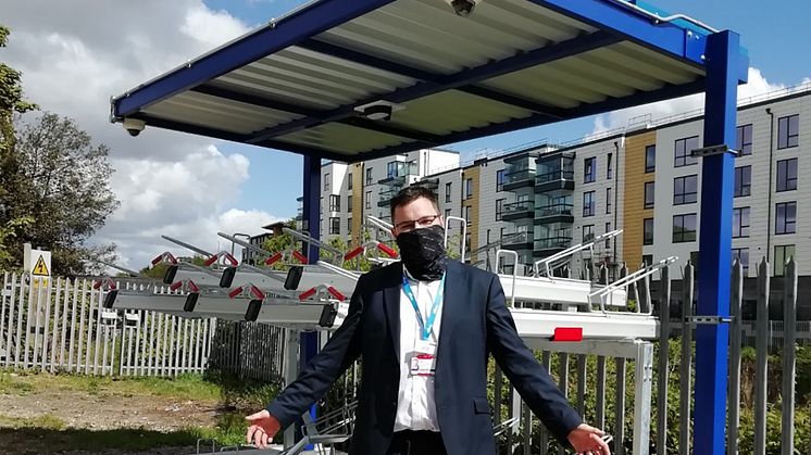 Solar-powered cycle security: Station Manager James Miller invites cyclists to New Southgate's environmentally friendly bike shelter