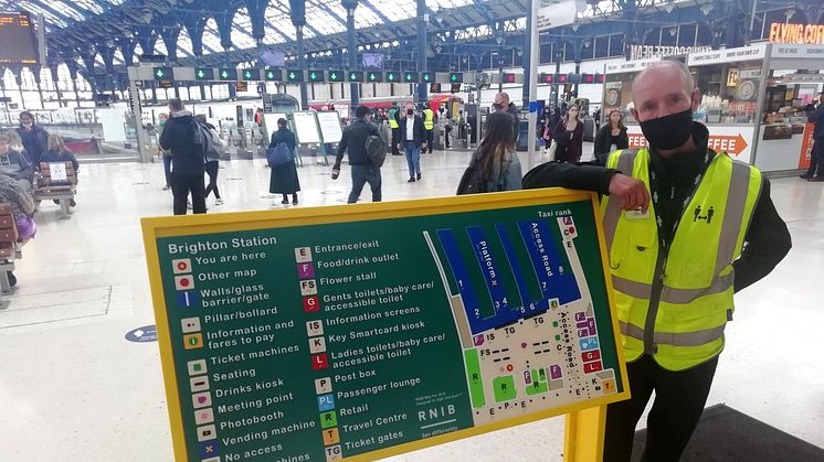 Brighton gateline supervisor Adrian Davis and the new tactile map