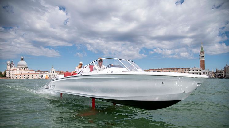 The ultra efficent, hydrofoiling Candela C-7 flying across the Gran Canale in Venice.