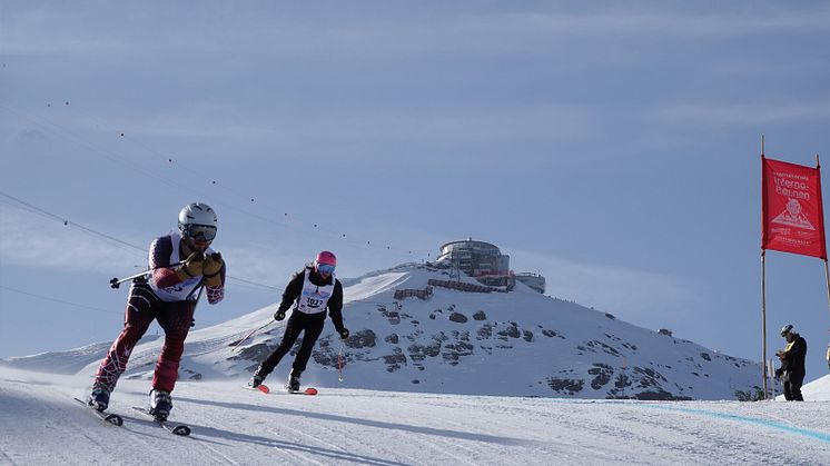 Two Inferno racers  and the Schilthorn - Piz Gloria in the background