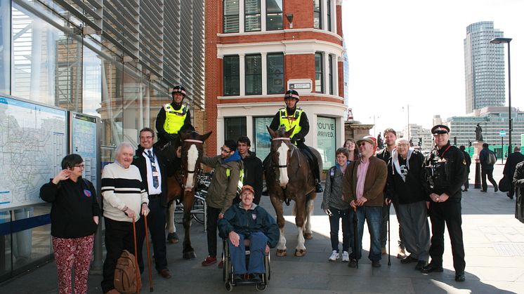 Brighton station manager Anthony Dowsett (third from left) gave disabled people a train ride to London Blackfriars station to help foster independent travel. They were welcomed there by the mounted branch of the City of London Police