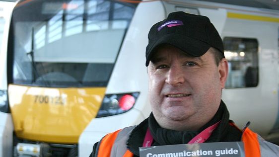 Pick a picture: platform assistant Daniel displays Govia Thameslink's new support card for passengers with communication difficulties