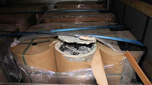 Cigarettes hidden inside asbestos and concrete tubes (SE 19.17)