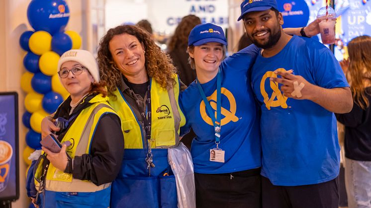 Auntie Anne's colleagues celebrate the store's opening event at Brighton station
