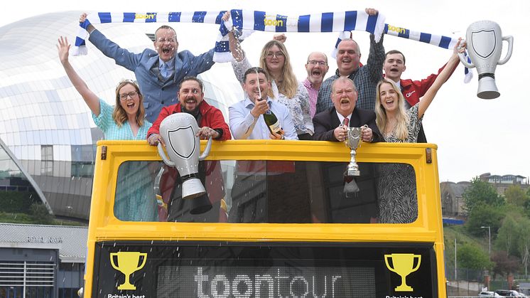 The team celebrate with Alex Warner from Great Scenic Journeys (and a spray of No-secco!) 