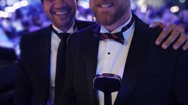 Agamemnon Otero and Jason Brooker hold their award.jpg