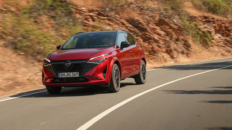 11. New refreshed Qashqai 2024 in fuji sunset color driving on the road in Faro, Portugal.jpg