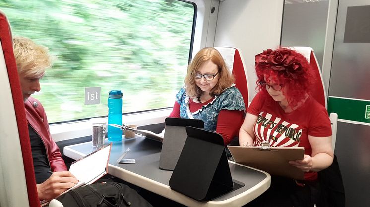 Participants enjoying their art class on a train experience