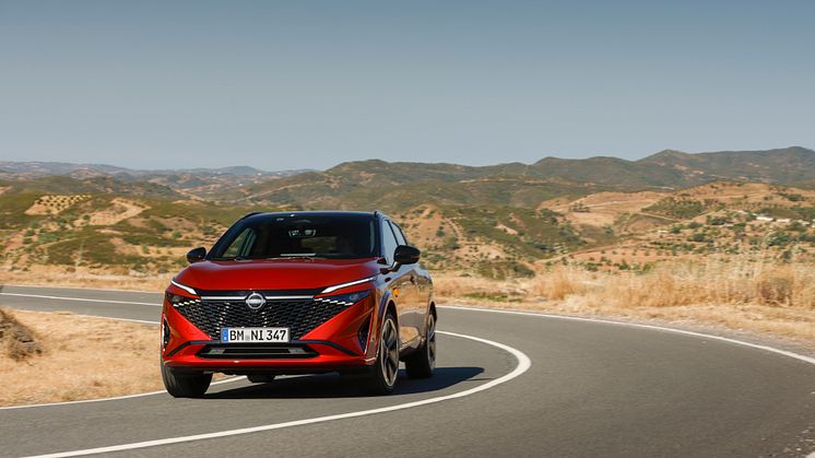 4. New refreshed Qashqai 2024 in fuji sunset color driving on the road in Faro, Portugal.jpg