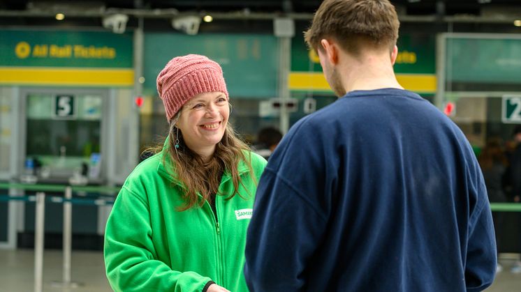 A Samaritans volunteer talks to a member of the public about the campaign. Image was taken in 2023