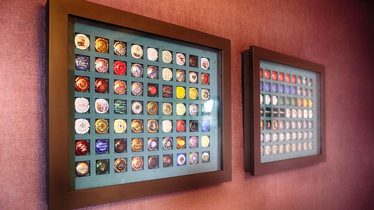 Champagne bottle top collection at Spedition Hotel, Thun, Switzerland, hotel design by Stylt Trampoli.JPG
