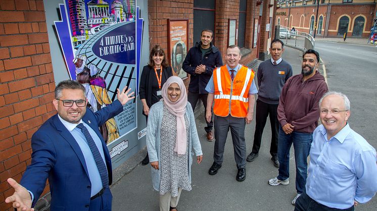 Community members at Small Heath station in Birmingham