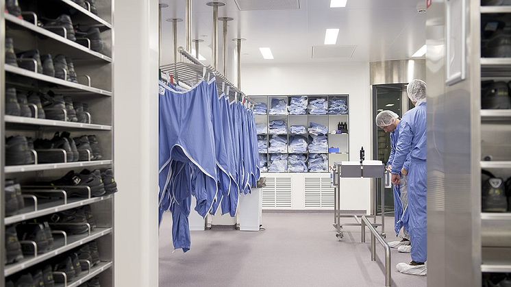 Pfizer scientists in scrubs