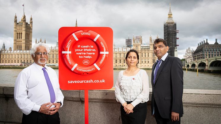 Naresh Patel (Branch Manager of Westminster Bridge Post Office), Bharti Patel (Postmaster at Churchill Place Post Office) and Subhash Patel (Postmaster at Canary Wharf Post Office) promoting 'Save Our Cash Day'
