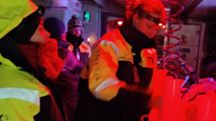 Processing water samples under red lights in the lab areas (Photo Rolf Gradinger)