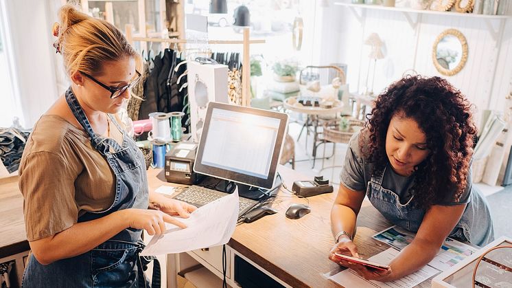 businesswomen checking shop papers SME.jpg