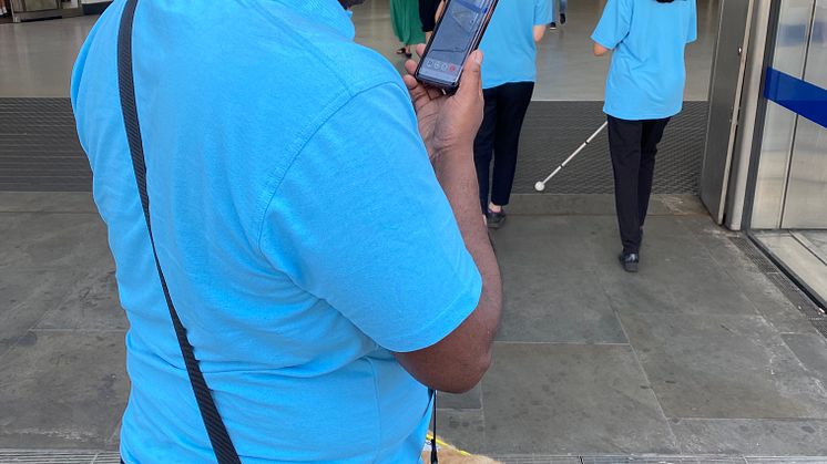 Sight Loss Council volunteer Haren trials the Aira app at Blackfriars station 