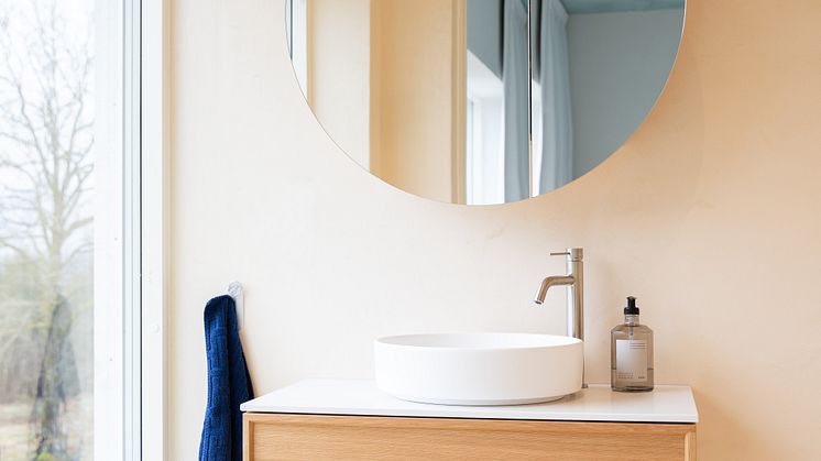 air wood vanity and circ mirror cabinet