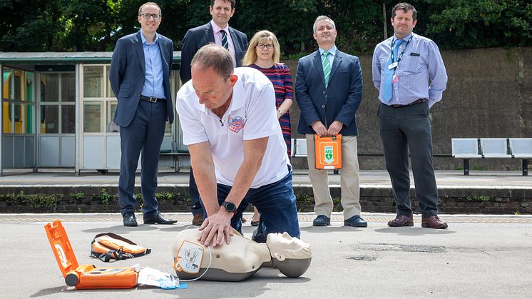 Resuscitation Trainer Steve Morris demos heart restarter to (l to r) Southern's Head of Safety Mark Whitley, Sussex Heart Charity (SHC) Trustees Chair Mike Lewis, Maria Caulfield MP,  SHC Vice-Chair Jason Palmer, Lewes Station Manager Andy Gardner