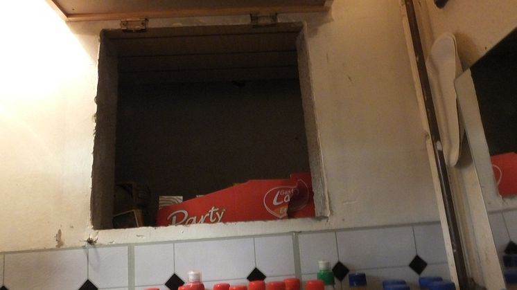 Op Batmobile - hole behind wall cupboard in Stoke shop NW04/15