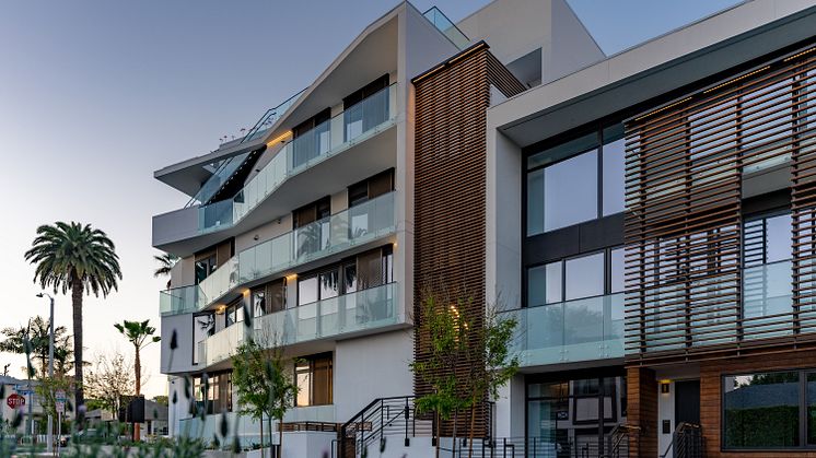 Augmenting the Harland's stucco façade are bronze metal screens, and Kebony modified wood louvres and vertical privacy screens. Kebony was also specified as decking for the outdoor environments.