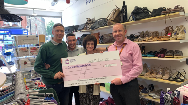 Selhurst Repair Shop colleagues Jon Dye, Tom Mills and Justin Lanigan with Jackie Lawrie, manager of Beckenham's Cancer Research shop