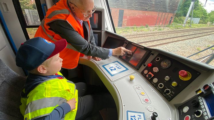 Driver manager Barry Minall shows Alfie the ropes.jpeg