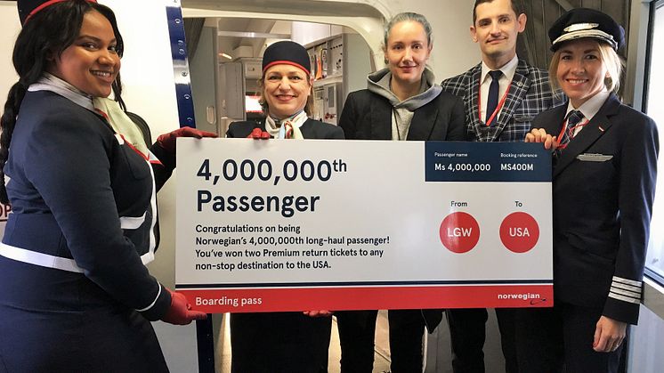 Norwegian's lucky passenger at LGW with crew members and pilot