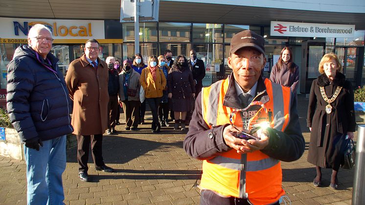 1980s pop mogul Pete Waterman (far left) joins residents of Elstree & Borehamwood to celebrate Thameslink's oldest employee, station assistant Siggy Cragwell (more images below)