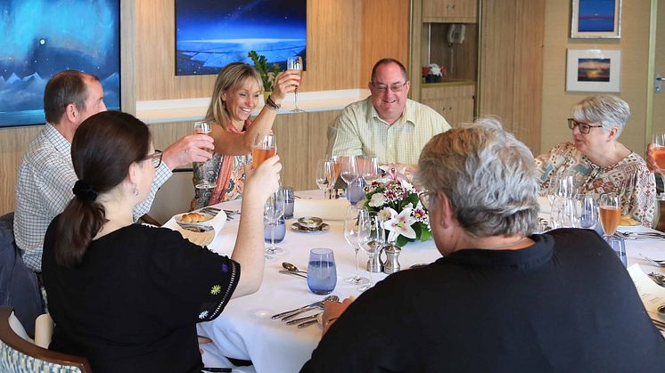 Michaela enjoys dinner with guests