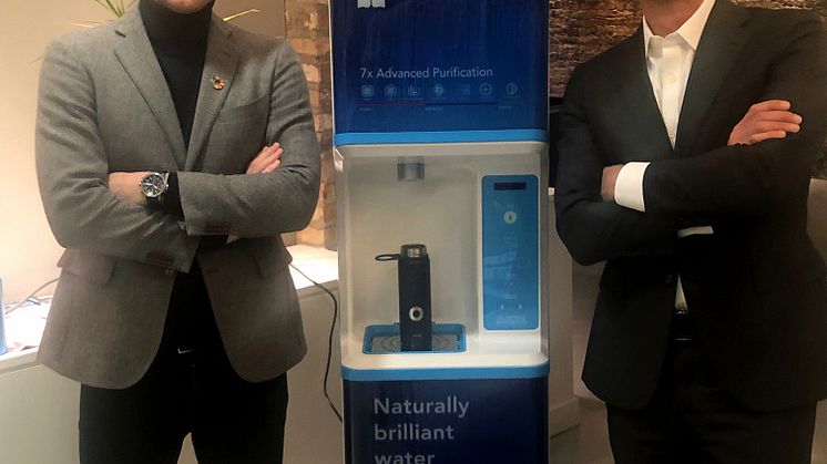 Bluewater President Anders Jacobson (left) and FloWater CEO and co-founder Rich Razgaitis (right) with a FloWater water station
