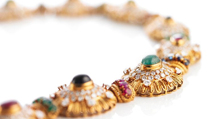 Van Cleef & Arpels: Diamond necklace set with cabochon- and cicular-cut rubies, sapphires, emeralds and brilliant-cut diamonds.